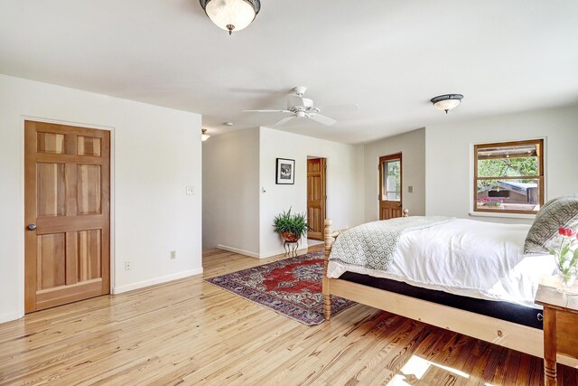 107 Rome Ln, Corrales, NM 87048 - bedroom with light wood-style floors and ceiling fan