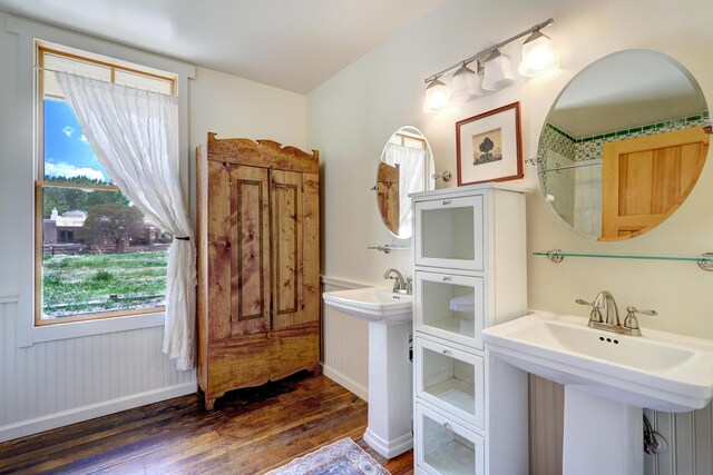 107 Rome Ln, Corrales, NM 87048 - full bath with hardwood / wood-style floors, a wainscoted wall, and a shower