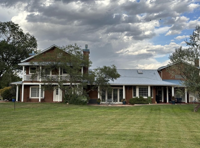 535 Cacahuate SW, Albuquerque, NM 87105 - view of front of home featuring a front yard and metal roof