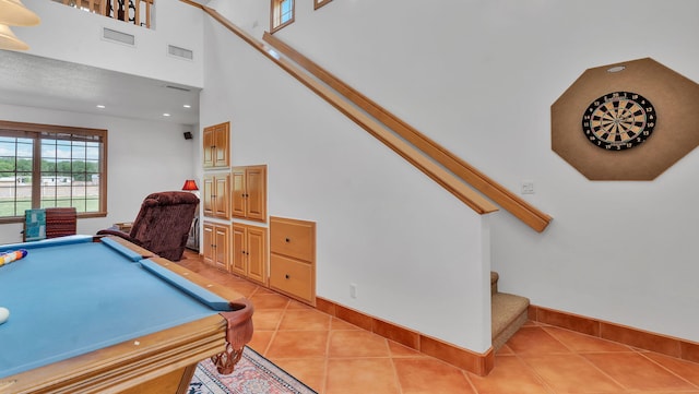 535 Cacahuate SW, Albuquerque, NM 87105 - game room with light tile patterned flooring, billiards, recessed lighting, baseboards, and a towering ceiling