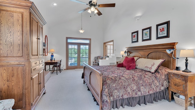 535 Cacahuate SW, Albuquerque, NM 87105 - bedroom with light colored carpet, access to exterior, high vaulted ceiling, and a ceiling fan
