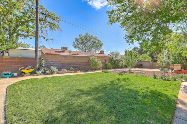 view of yard featuring a fenced backyard