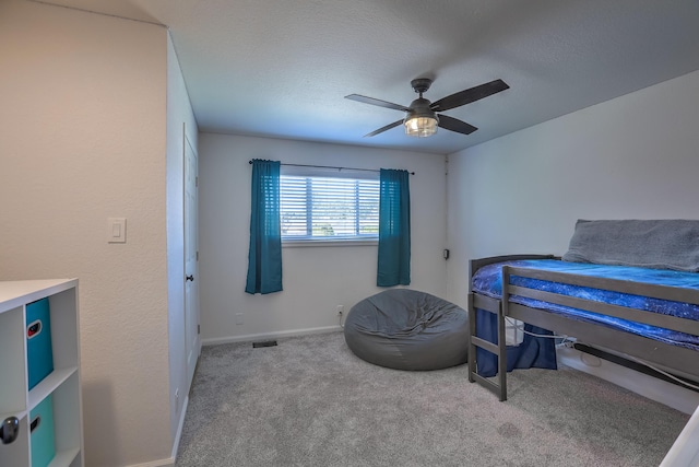 bedroom with carpet floors, baseboards, and ceiling fan