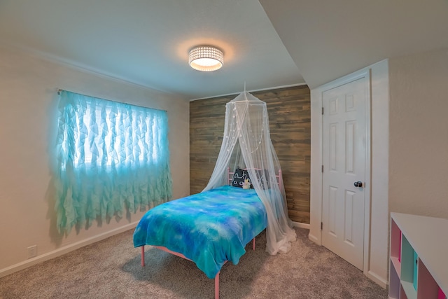 bedroom with carpet floors and baseboards