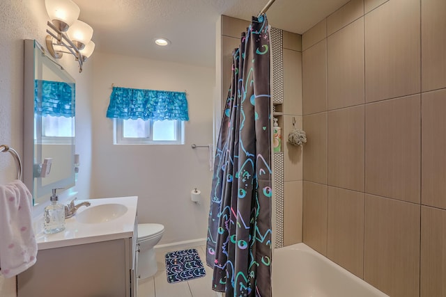 bathroom with vanity, tile patterned flooring, shower / bath combination with curtain, toilet, and baseboards