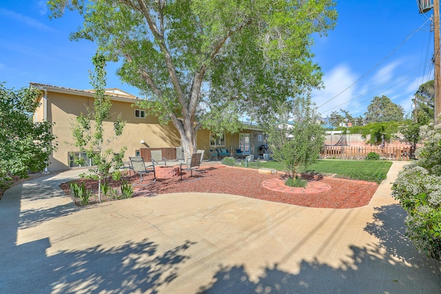 view of yard featuring a patio and fence