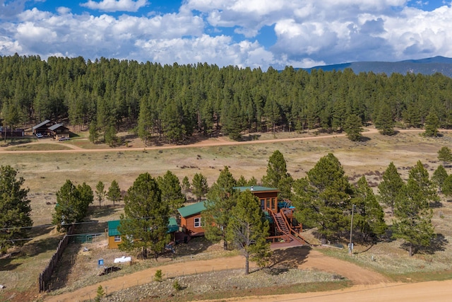 aerial view with a mountain view and a forest view