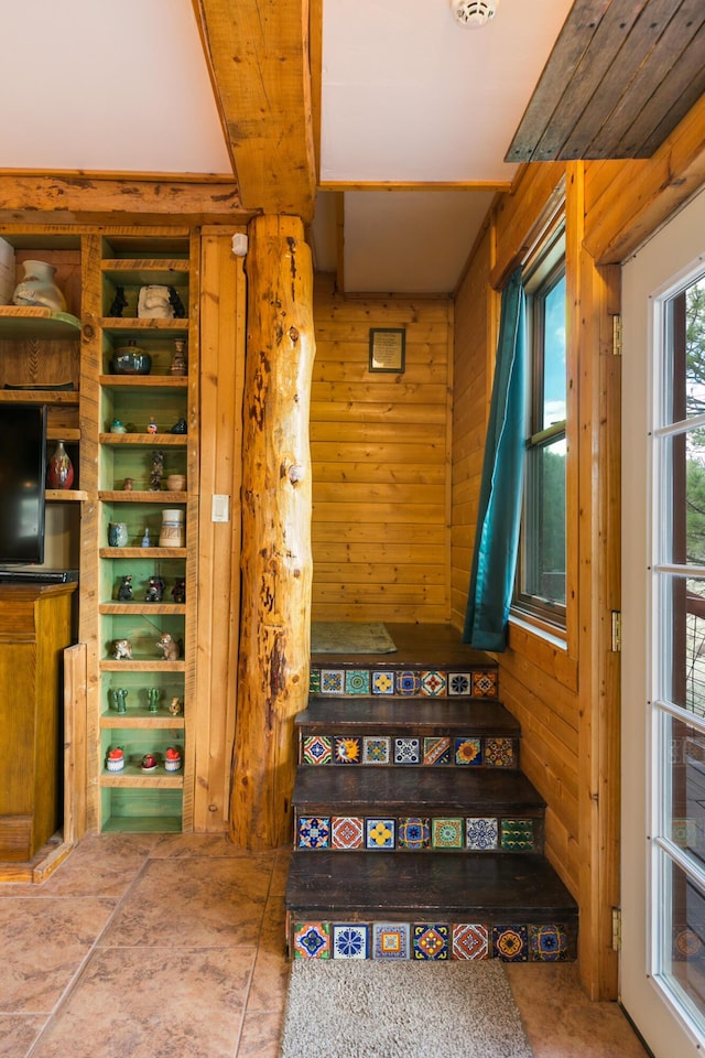staircase with wooden walls
