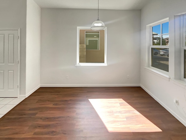 2009 Alama Dr NE, Rio Rancho, NM 87124 - unfurnished dining area with baseboards and wood finished floors