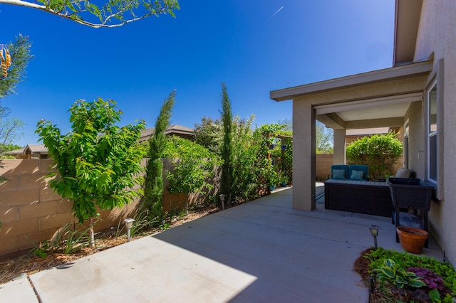 view of patio / terrace featuring a fenced backyard and an outdoor living space