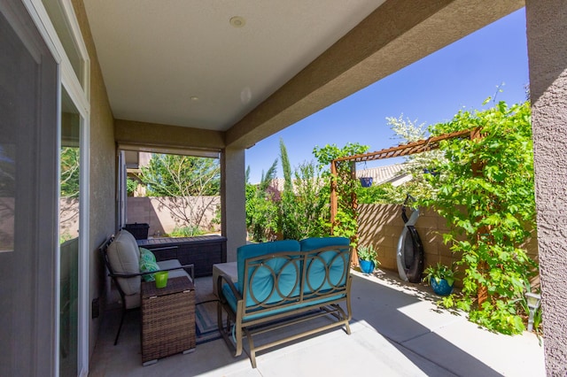 view of patio / terrace with an outdoor living space and a fenced backyard