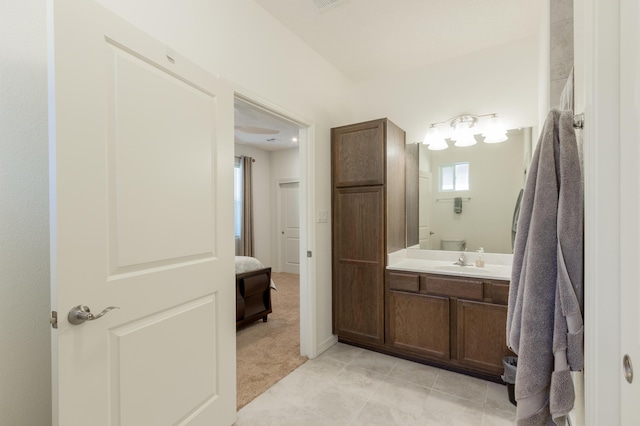 bathroom featuring tile patterned flooring and vanity