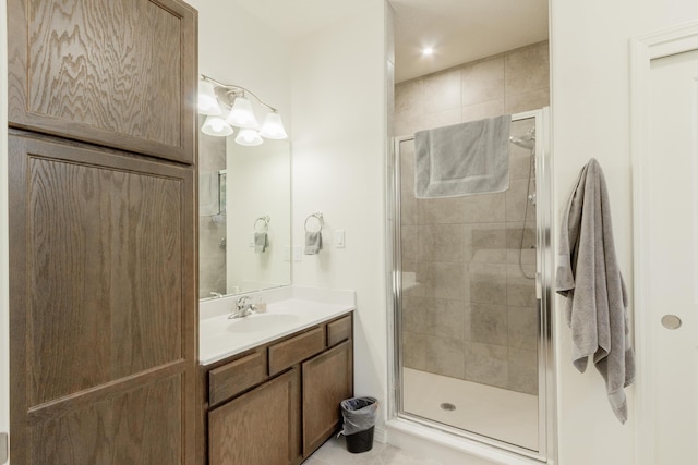 full bathroom with vanity and a stall shower