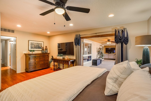 bedroom with visible vents, wood finished floors, baseboards, recessed lighting, and a ceiling fan