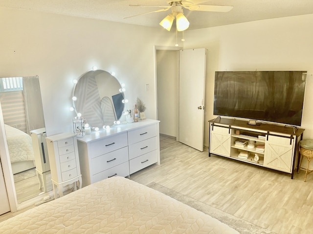 bedroom featuring ceiling fan and light wood finished floors