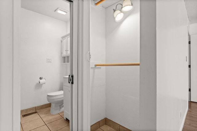 5812 Alegria Rd NW, Albuquerque, NM 87114 - bathroom featuring toilet, baseboards, visible vents, and tile patterned flooring