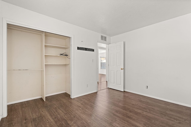 5812 Alegria Rd NW, Albuquerque, NM 87114 - unfurnished bedroom with visible vents, baseboards, wood finished floors, and a closet