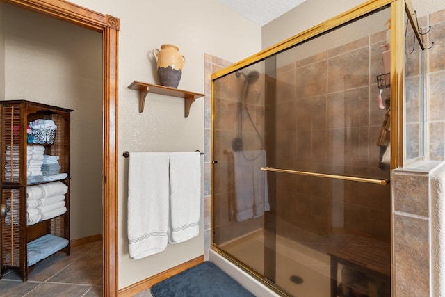 3809 Bay Hill Loop SE, Rio Rancho, NM 87124 - bathroom featuring baseboards and a stall shower