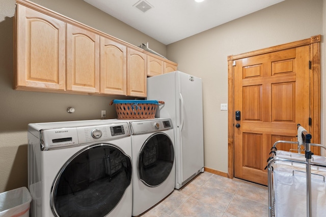 3809 Bay Hill Loop SE, Rio Rancho, NM 87124 - clothes washing area with washing machine and clothes dryer, visible vents, cabinet space, light tile patterned floors, and baseboards