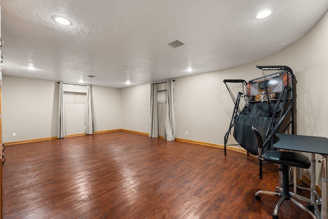 3809 Bay Hill Loop SE, Rio Rancho, NM 87124 - finished basement featuring visible vents, baseboards, a textured ceiling, and wood finished floors