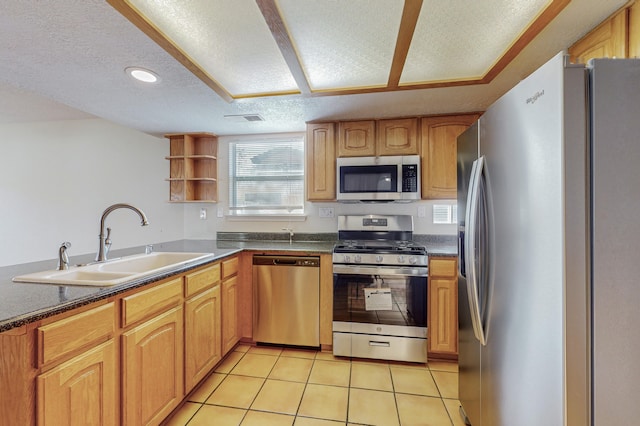kitchen with visible vents, open shelves, dark countertops, a sink, and stainless steel appliances