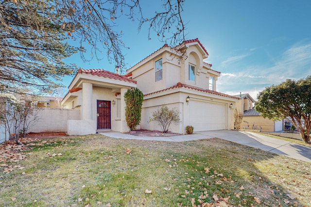 mediterranean / spanish home featuring fence, a tile roof, a garage, stucco siding, and driveway