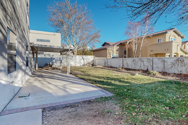 view of yard with a fenced backyard and a patio area