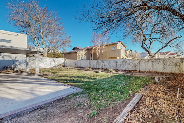 view of yard with a patio and a fenced backyard