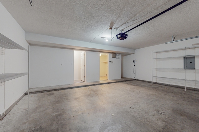 garage featuring a garage door opener and electric panel