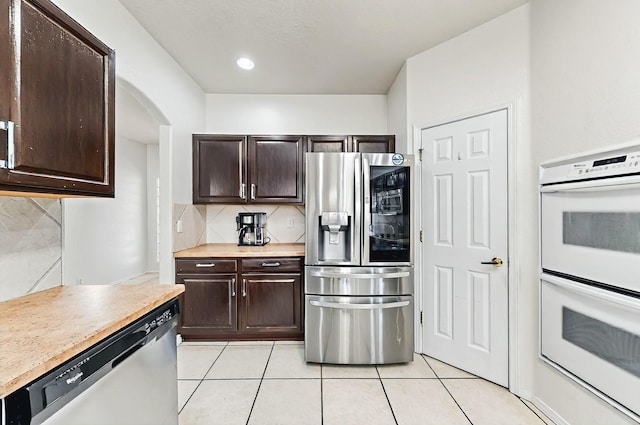 4954 Dream Dancer Dr NE, Rio Rancho, NM 87144 - kitchen featuring white double oven, decorative backsplash, stainless steel refrigerator with ice dispenser, and dishwasher