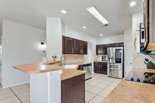 4954 Dream Dancer Dr NE, Rio Rancho, NM 87144 - kitchen with a sink, appliances with stainless steel finishes, light tile patterned floors, and dark brown cabinetry
