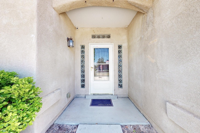 4954 Dream Dancer Dr NE, Rio Rancho, NM 87144 - doorway to property with stucco siding