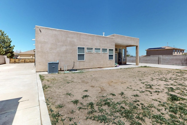 4954 Dream Dancer Dr NE, Rio Rancho, NM 87144 - rear view of house featuring central air condition unit, a patio, stucco siding, and a fenced backyard
