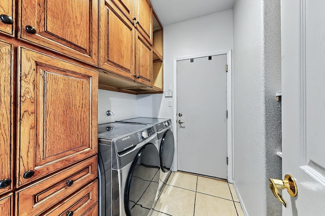 4954 Dream Dancer Dr NE, Rio Rancho, NM 87144 - clothes washing area featuring independent washer and dryer, light tile patterned floors, and cabinet space