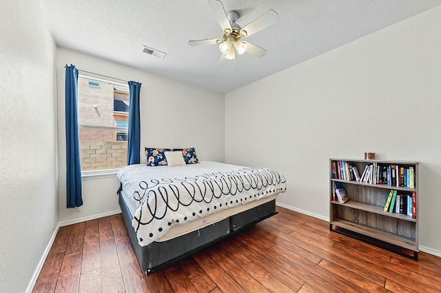 4954 Dream Dancer Dr NE, Rio Rancho, NM 87144 - bedroom featuring visible vents, a ceiling fan, baseboards, and hardwood / wood-style flooring