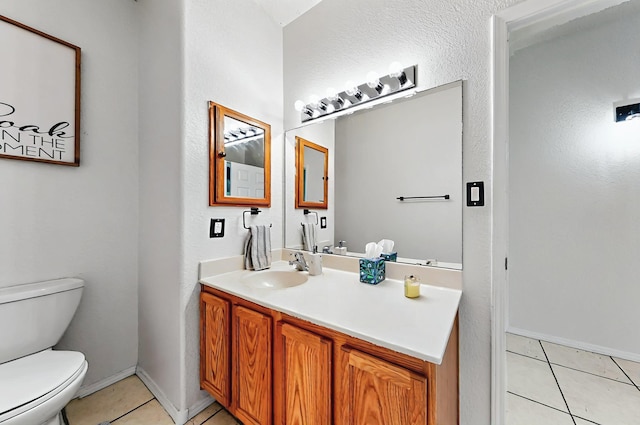 4954 Dream Dancer Dr NE, Rio Rancho, NM 87144 - bathroom featuring vanity, tile patterned flooring, baseboards, and toilet