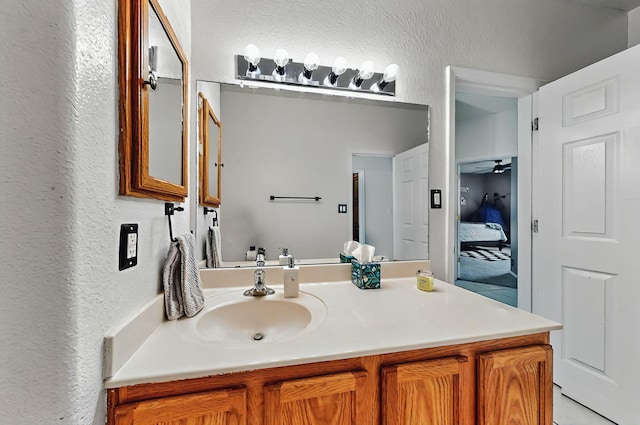 4954 Dream Dancer Dr NE, Rio Rancho, NM 87144 - bathroom with a textured wall and vanity
