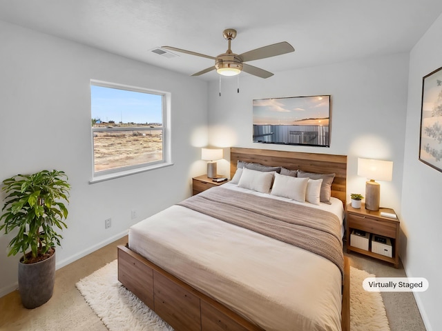bedroom with carpet floors, a ceiling fan, baseboards, and visible vents