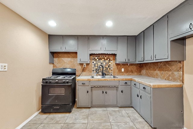 7121 Isleta Blvd SW Rear, Rear, Albuquerque, NM 87105 - kitchen featuring black gas range, a sink, gray cabinetry, backsplash, and recessed lighting