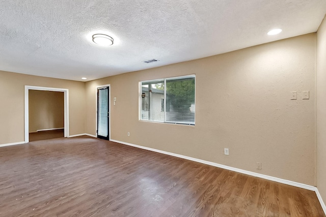 7121 Isleta Blvd SW Rear, Rear, Albuquerque, NM 87105 - spare room with wood finished floors, baseboards, and a textured ceiling