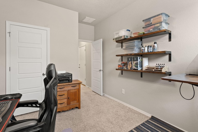 office space featuring baseboards and light colored carpet