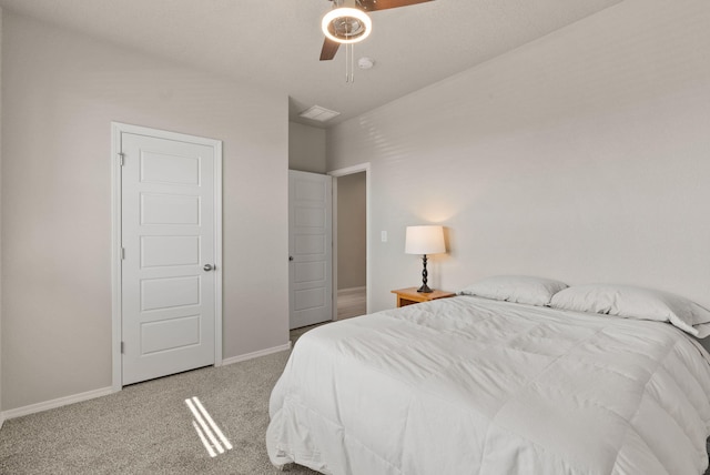 carpeted bedroom with baseboards and ceiling fan