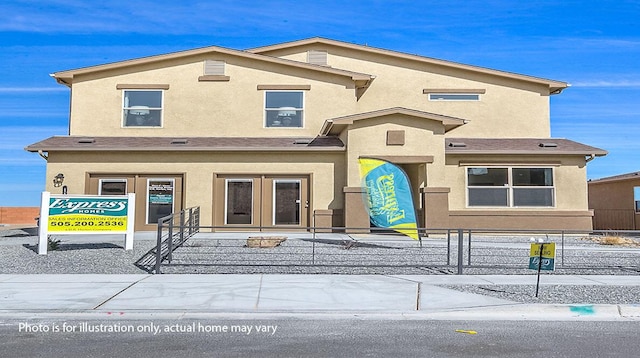 1644 Maggie Ct NE, Rio Rancho, NM 87144 - view of front of property with a fenced front yard, stucco siding, and french doors