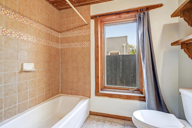 545 Atrisco Dr NW, Albuquerque, NM 87105 - bathroom with toilet, baseboards, tile patterned flooring, and bathtub / shower combination