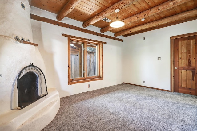 545 Atrisco Dr NW, Albuquerque, NM 87105 - unfurnished living room featuring wooden ceiling, beam ceiling, carpet floors, and visible vents