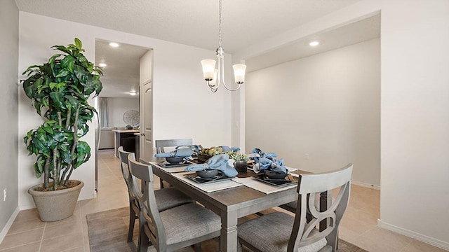 dining area with baseboards, recessed lighting, a chandelier, and light tile patterned flooring