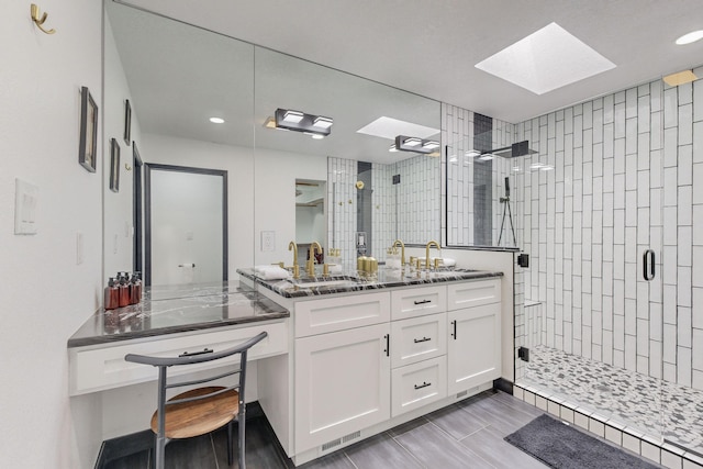 7218 Whippoorwill Ln NE, Albuquerque, NM 87109 - full bath featuring a skylight, vanity, a stall shower, and recessed lighting