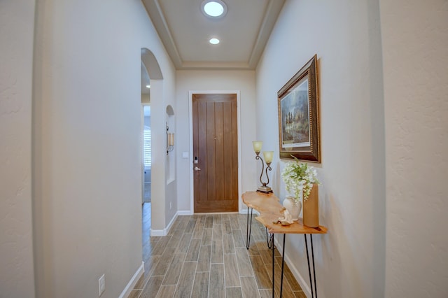 7408 Molas Rd NW, Albuquerque, NM 87114 - entryway with arched walkways, wood tiled floors, and baseboards