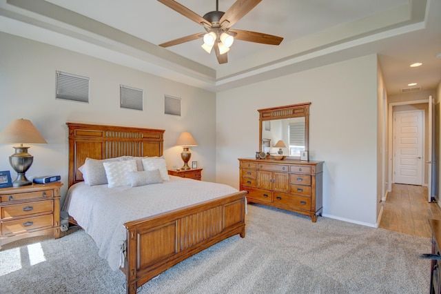 7408 Molas Rd NW, Albuquerque, NM 87114 - bedroom with a tray ceiling, light carpet, recessed lighting, baseboards, and a ceiling fan