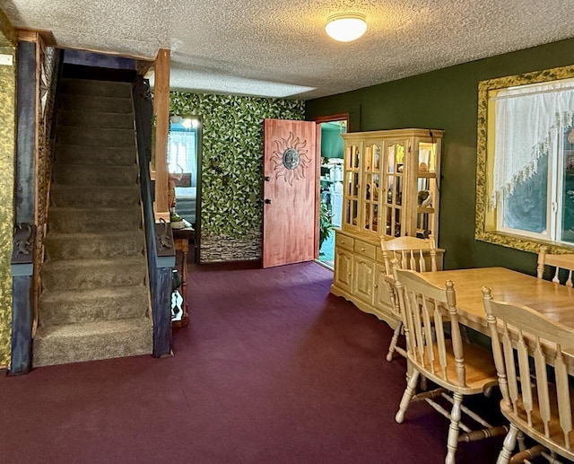 10 Cliffside Dr, Ramah, NM 87321 - carpeted dining space with stairway and a textured ceiling